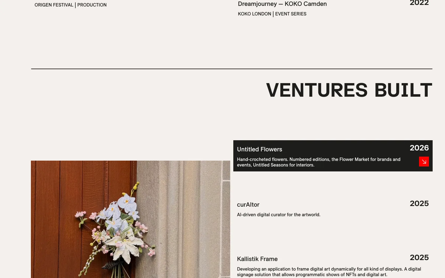 The section Ventures built: a photo of a bouquet of crocheted flowers on a wooden door beside a list of four ventures with years, the first one highlighted in a black bar with a small red arrow button, then the heading In the press.