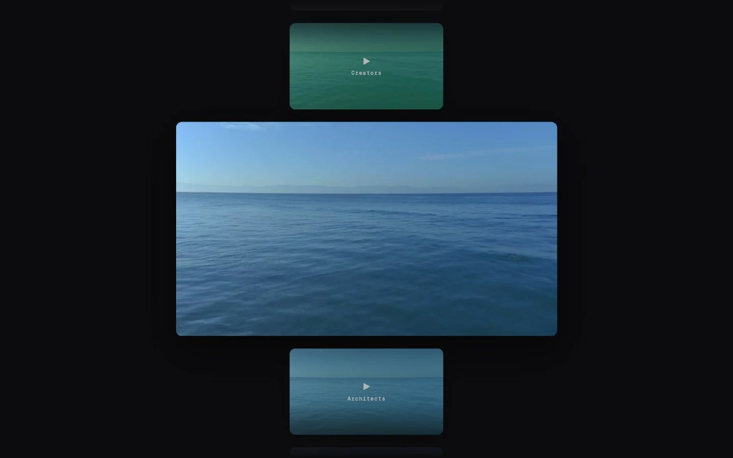 A dark page with one large video tile in the middle and smaller tiles above and below it, filled with sample footage of a calm sea.