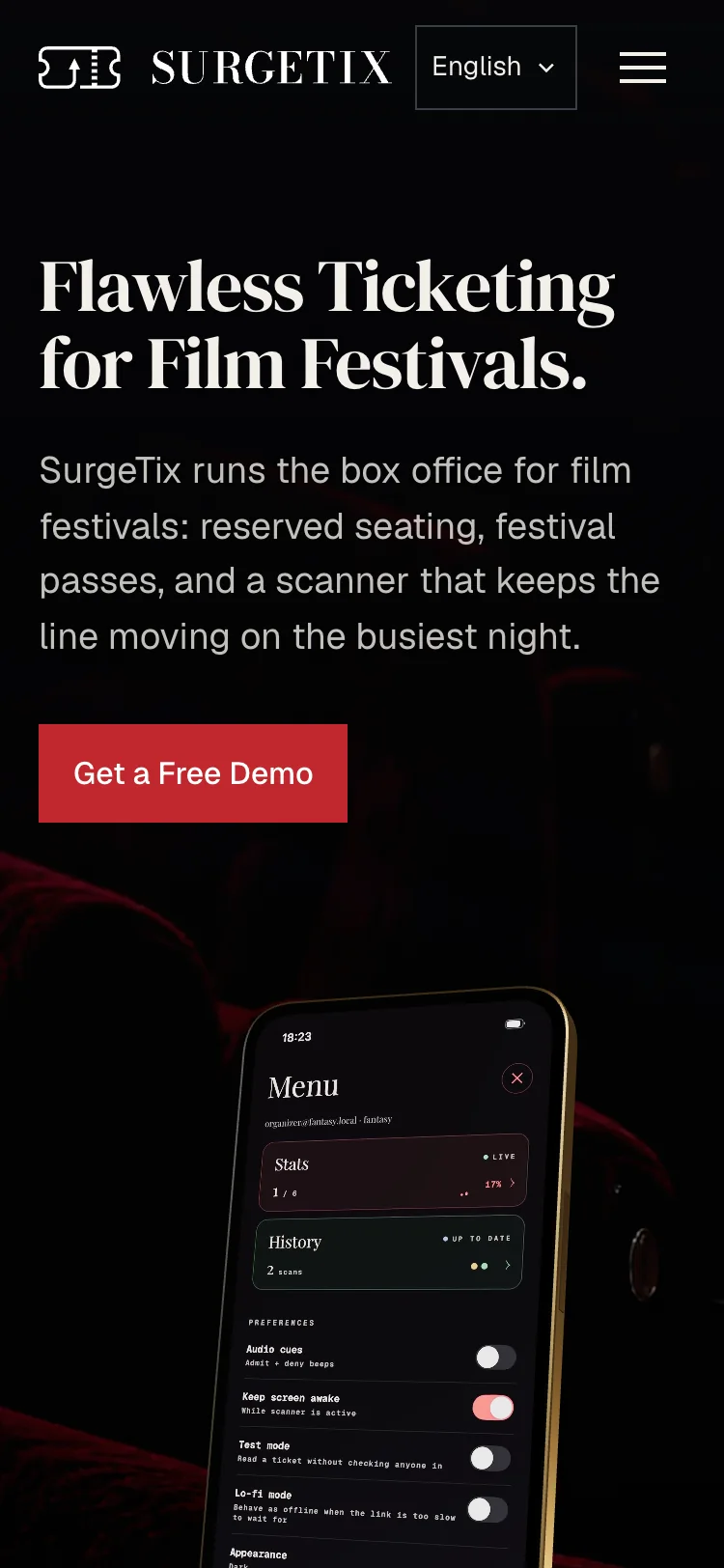 The same hero at phone width: the logo and a menu button, the headline over three lines, the text, the red button, and the top of the phone below.
