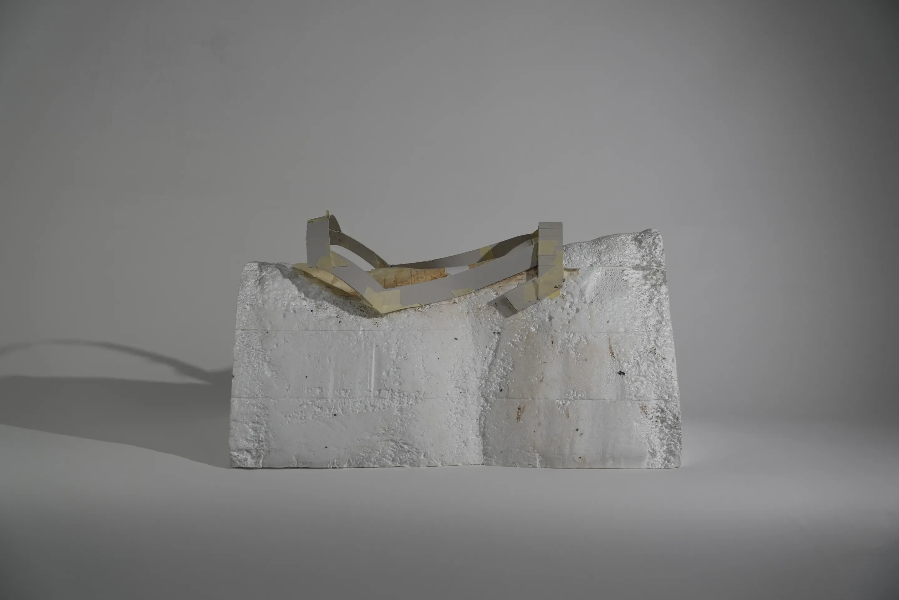 Prototype step: a frame of grey card strips on the foam block.