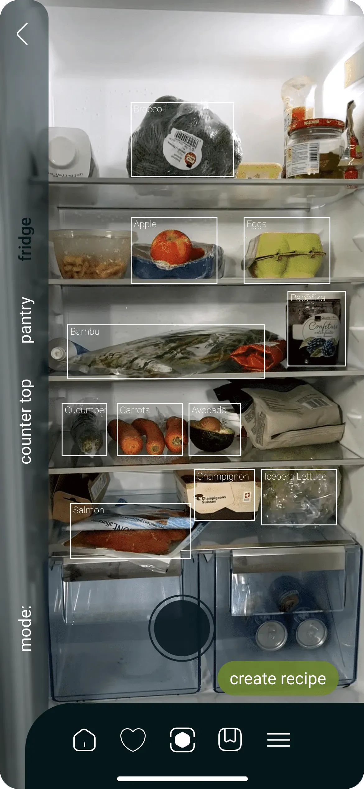 Scan screen: a photo of an open fridge with white frames around the food, labelled Broccoli, Apple, Eggs, Paprika, Bambu, Cucumber, Carrots, Avocado, Champignon, Iceberg Lettuce and Salmon. On the left edge the words fridge, pantry and counter top, at the bottom a round shutter button and an olive green button reading create recipe.