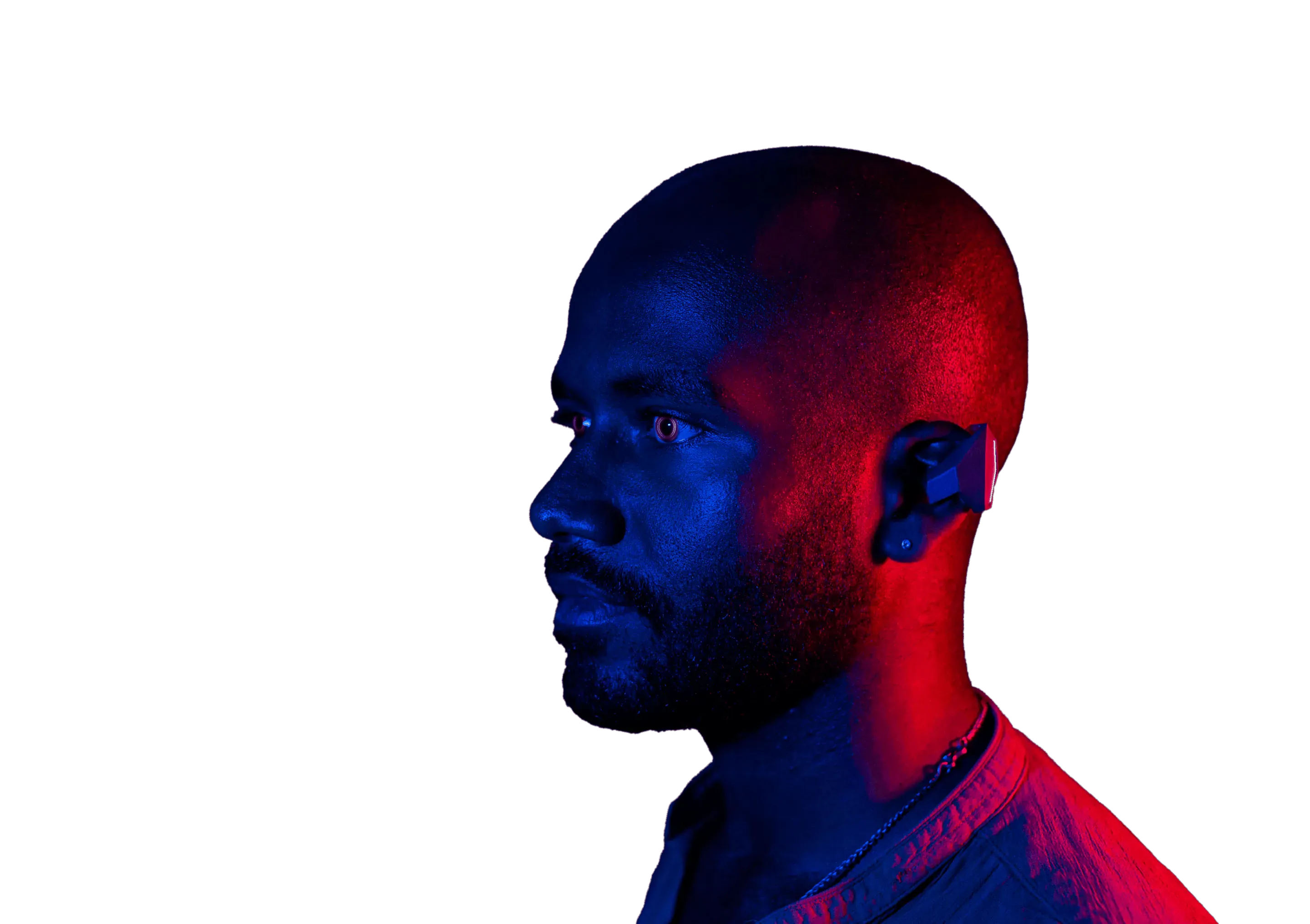 Side profile of a man in red and blue light wearing the Phonic AR open-ear earbud.