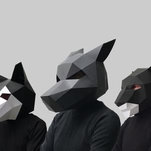 Moodboard picture: three people in black wear grey and black low poly animal masks.