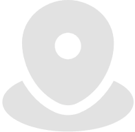 Icon: a map pin, light grey, solid and rounded.