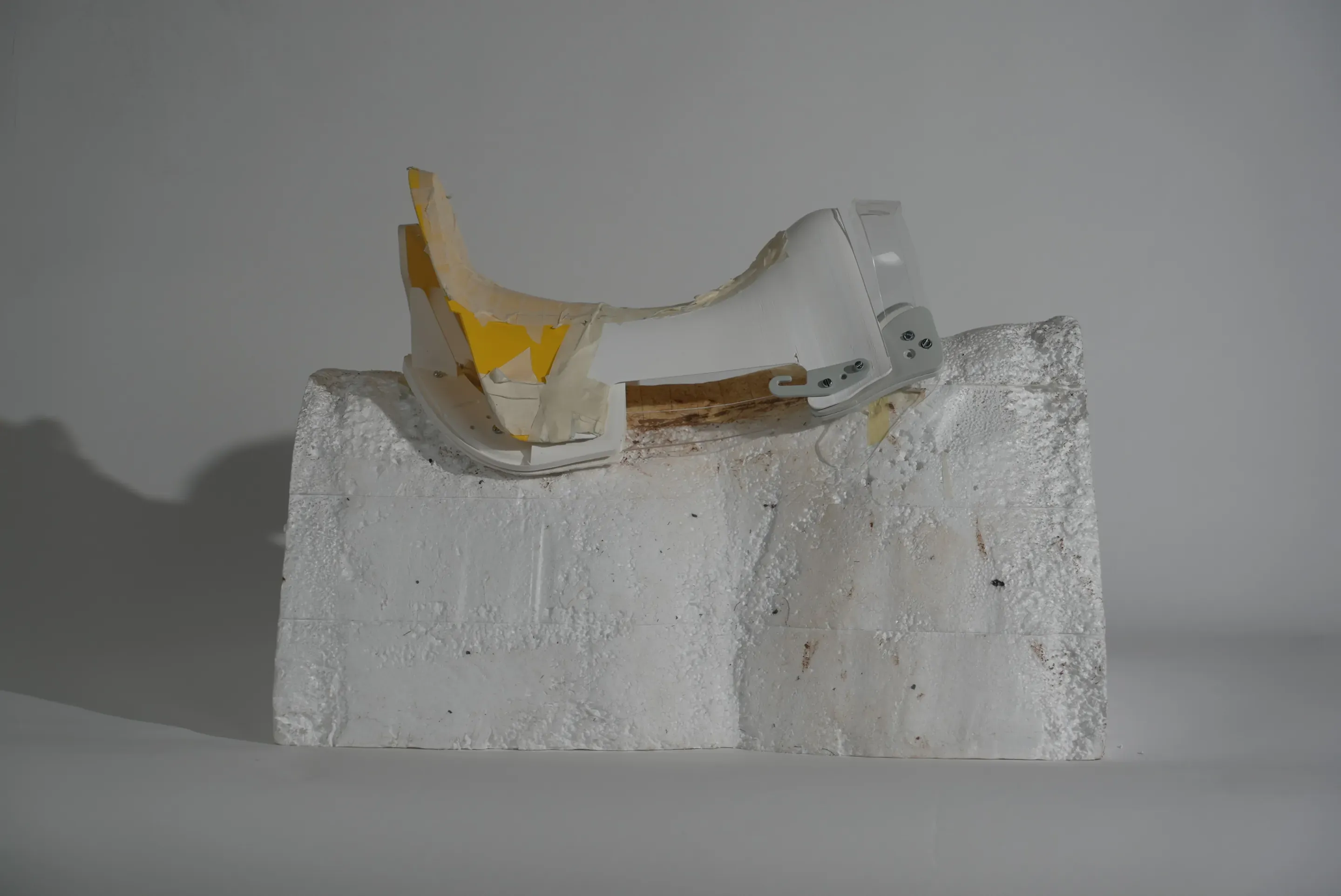Prototype step: a white printed tree with a tan and yellow shell laid over the front, on the foam block.
