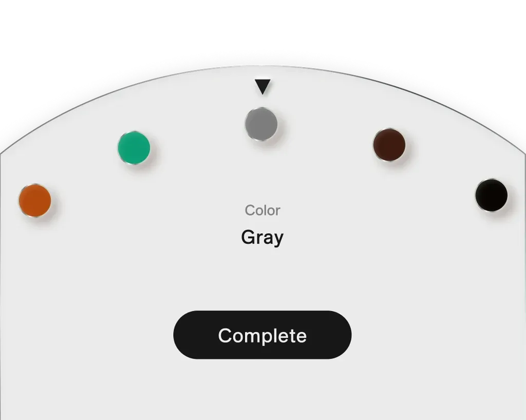Colour picker: five round colour dots along an arc, orange, green, grey, brown and black, with grey selected, the word Gray and a black Complete button.