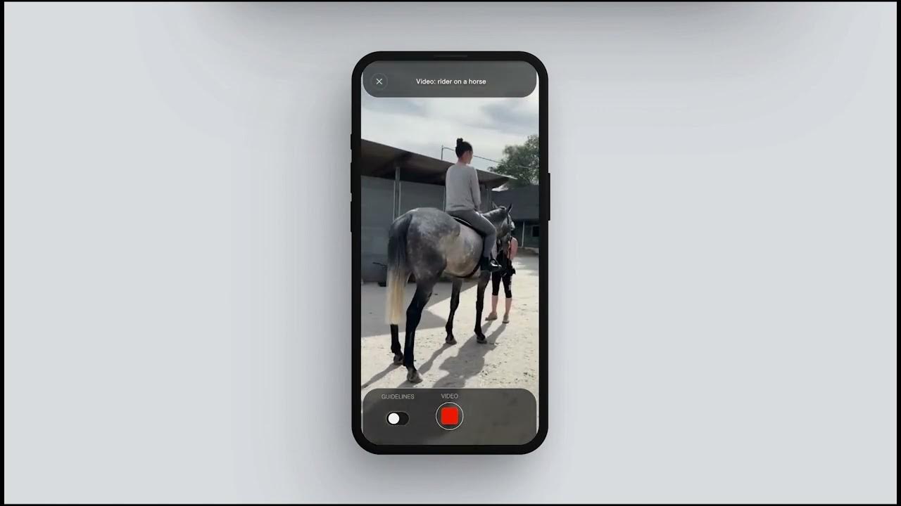 Film still: a phone records a rider sitting on a dapple grey horse, seen from behind, under the title Video: rider on a horse.