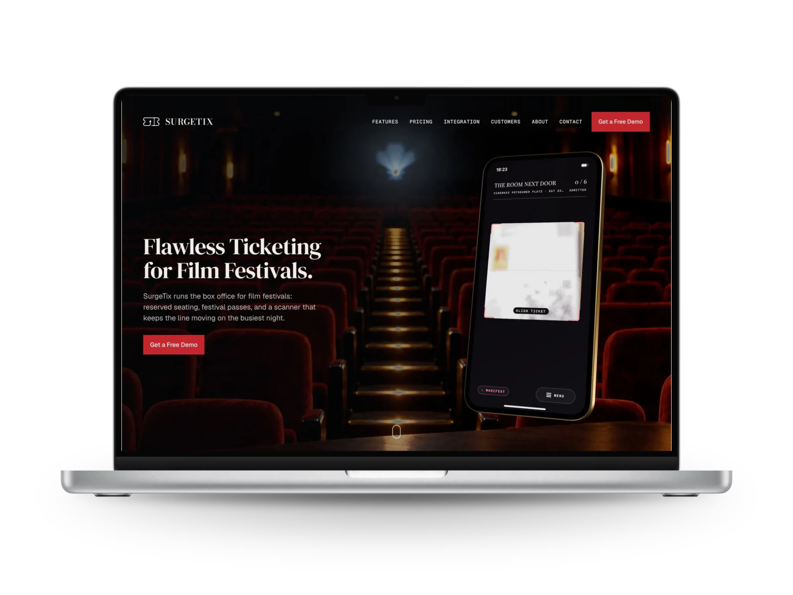 SurgeTix: the home page of the website on a laptop, the headline Flawless Ticketing for Film Festivals beside a phone, over rows of red cinema seats.